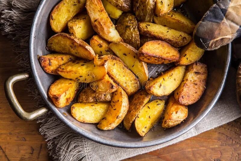 Пожарить картошку в духовке фото Potato. Roasted Potatoes. American Potatoes with Salt Pepper and Cumin Stock Pho