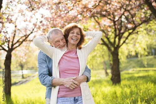 Пожилые на природе фото Beautiful senior couple in love outside in spring nature. фотография Stock Adobe