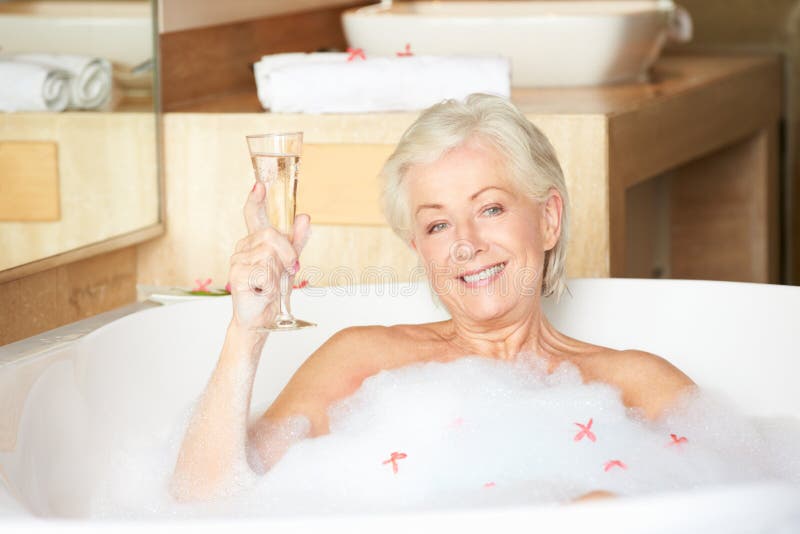 Пожилые в ванной фото Senior Woman Relaxing Bath Drinking Champagne Stock Photos - Free & Royalty-Free