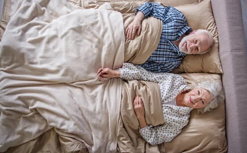 Пожилые женщины на кровати фото Calm Senior Couple Waking Up in the Morning Stock Image - Image of bedtime, happ