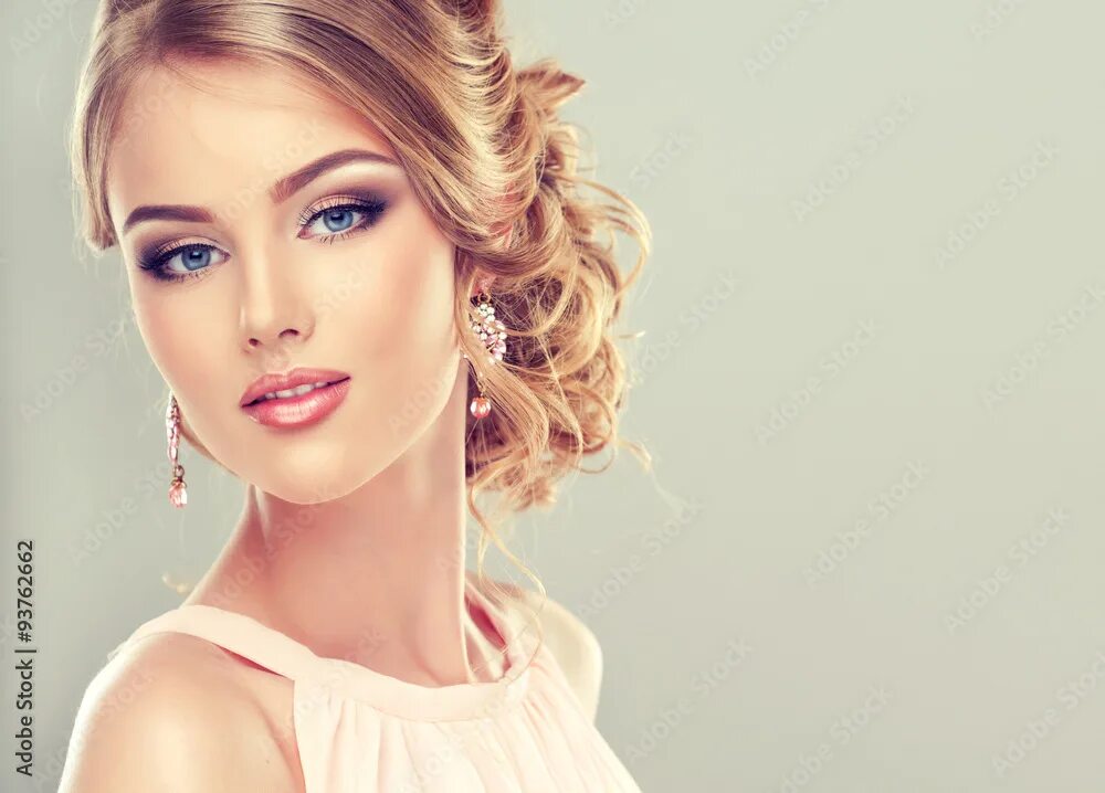 Прически макияж девушек фото Beautiful model with elegant hairstyle . Beautiful woman with fashion wedding ha