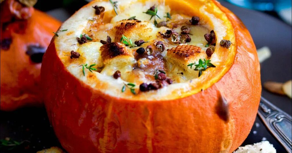 Stuffed mini pumpkins with cranberry and pecan vegetable wild rice in a casserol