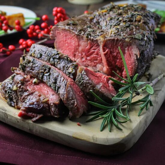 Beef rump steak on black stone table Фотографія Stock Adobe Stock