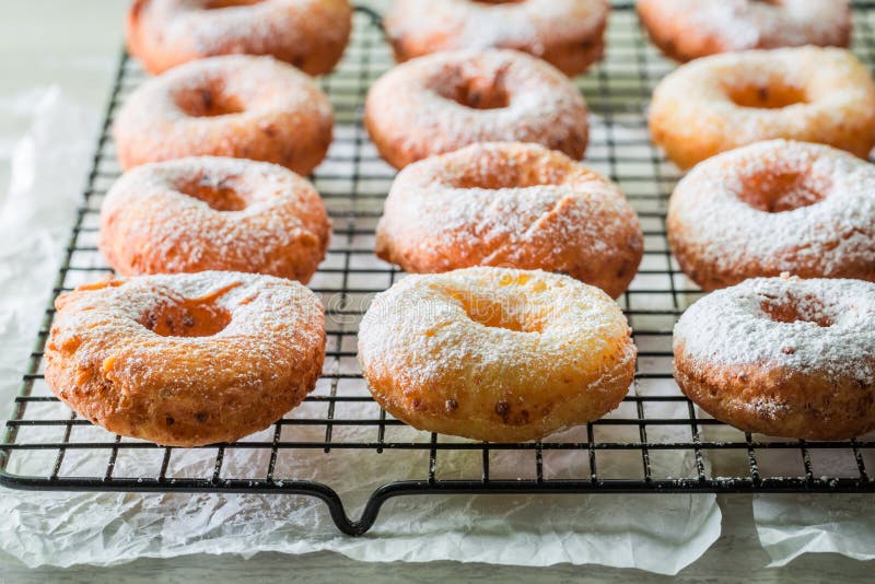 Приготовление пончиков фото Yummy and Homemade Pink Donuts for Fat Thursday Stock Photo - Image of decoratio