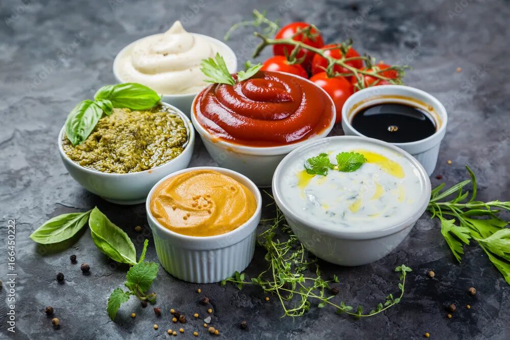 Приготовления соуса фото Selection of different sauces in bowls фотография Stock Adobe Stock