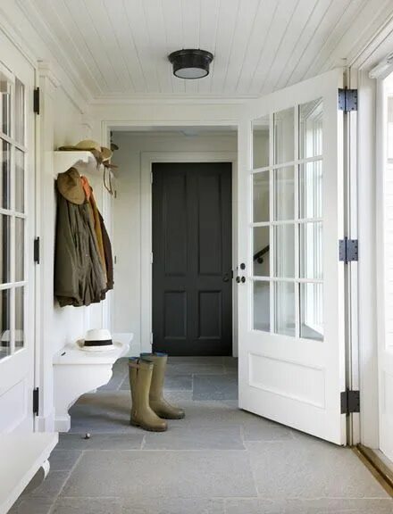 Прихожая тамбур в частном доме дизайн фото Modern Farmhouse Entry with planked ceiling, the wall-mounted benches, bluestone