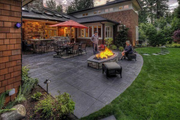 Пример обустройства двора частного дома Stamped concrete adds depth and beauty to the exterior Concrete patio designs, P