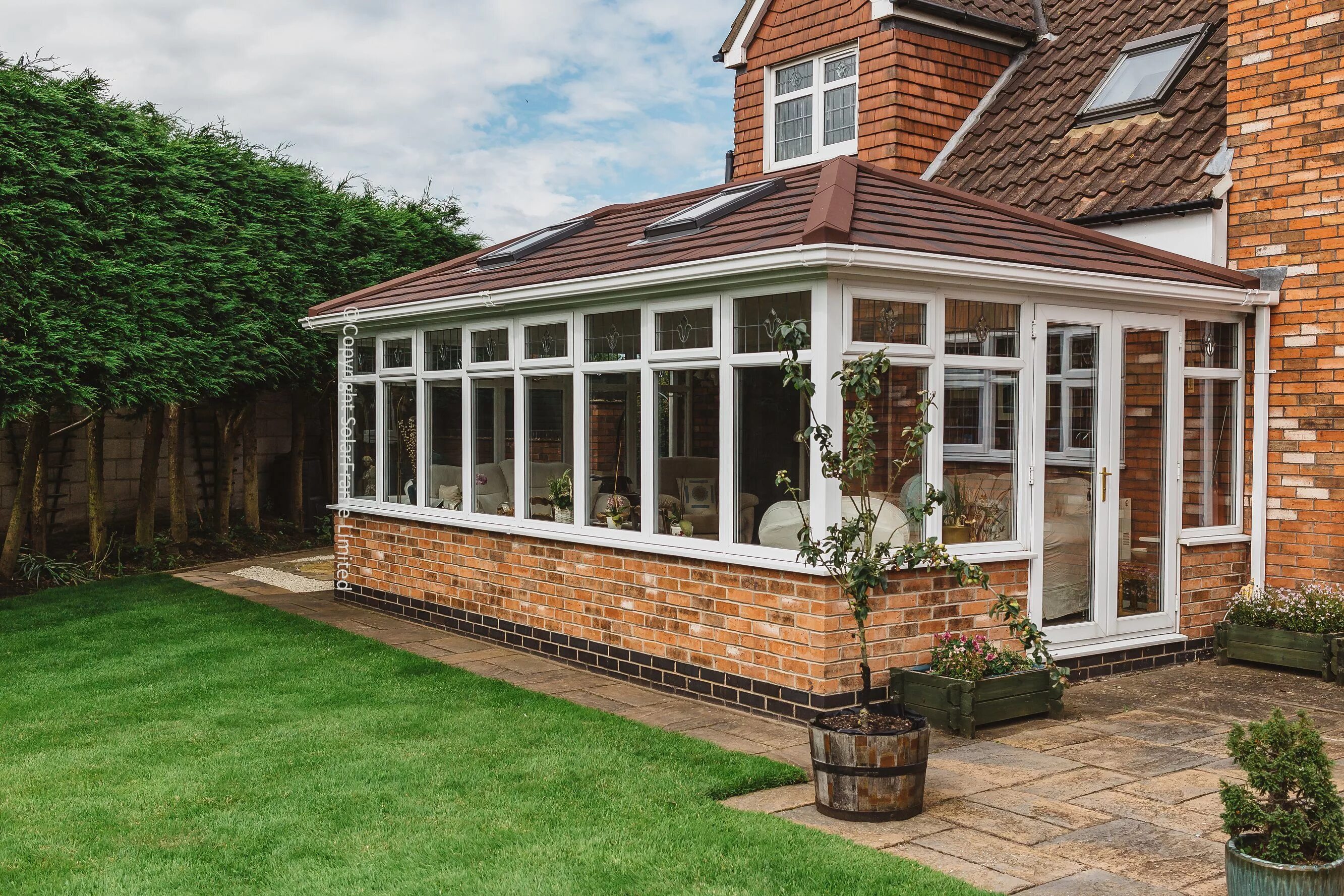 Примеры веранд пристроенных к дому фото Solid Tiled Conservatory Roof by SolarFrame Backyard patio designs, House extens