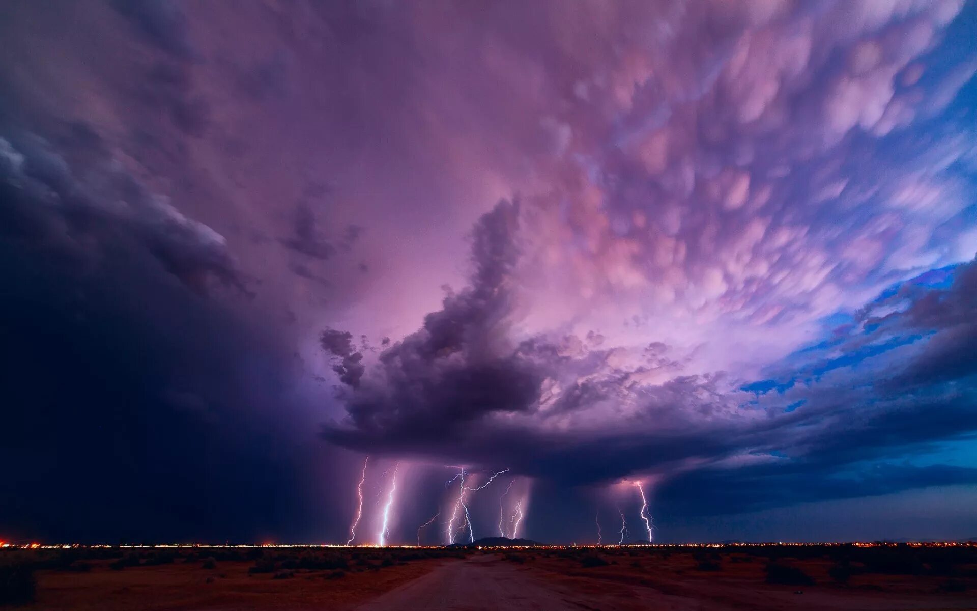 Природные явления фото Purple lightning from a thunderstorm cloud Desktop wallpapers 1920x1080