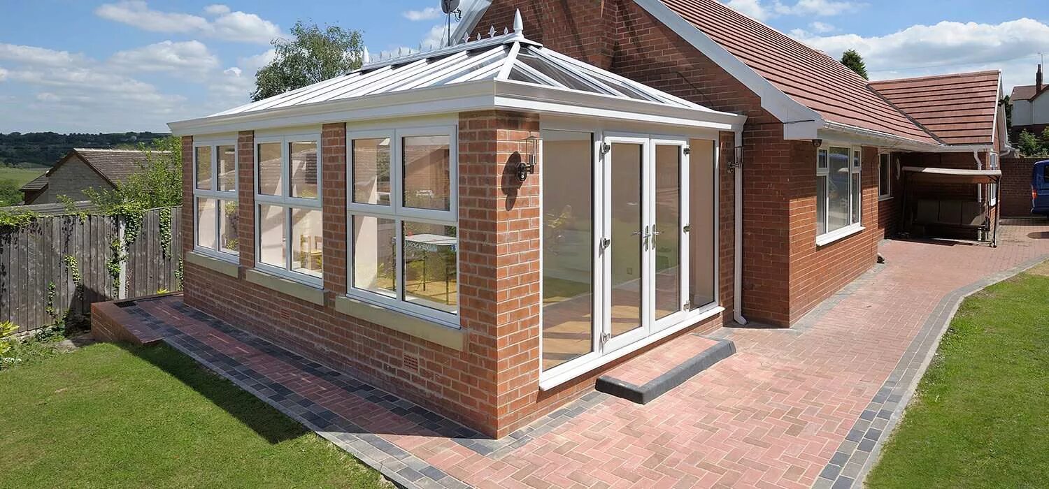 Пристрой к дому из кирпича фото Conservatories MGP Windows and Doors - Cardiff