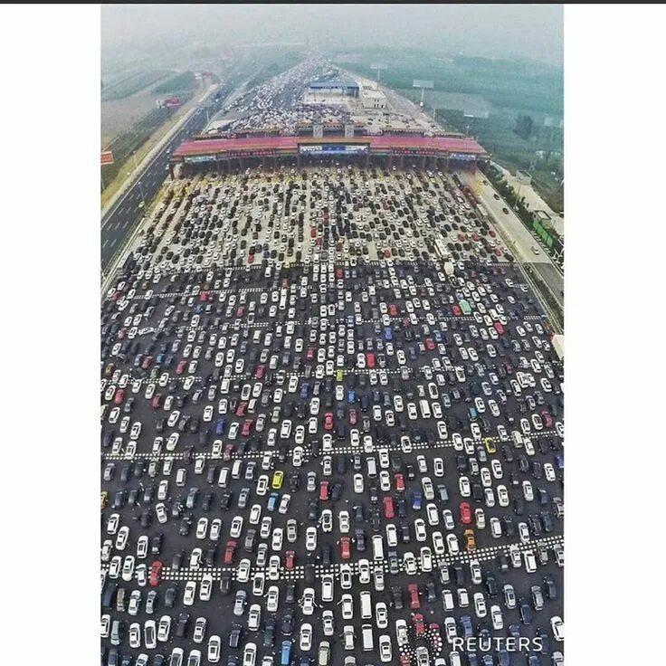 Пробки в китае фото Reuters on Instagram: "Vehicles are seen stuck in a traffic jam near a toll stat