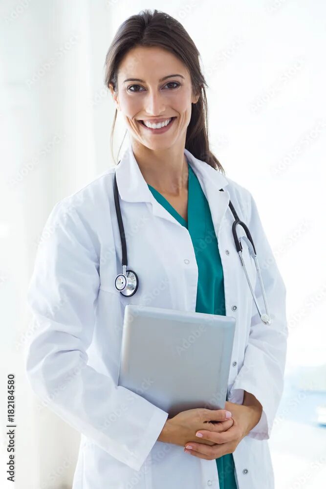 Профессия доктор врач фото Beautiful young female doctor looking at camera in the office. Фотографія Stock 