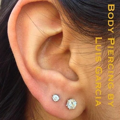 Прокол двух ушей фото Fresh second earlobe piercing with Anatometal 3mm prong set CZ (at NoKaOi Tiki T