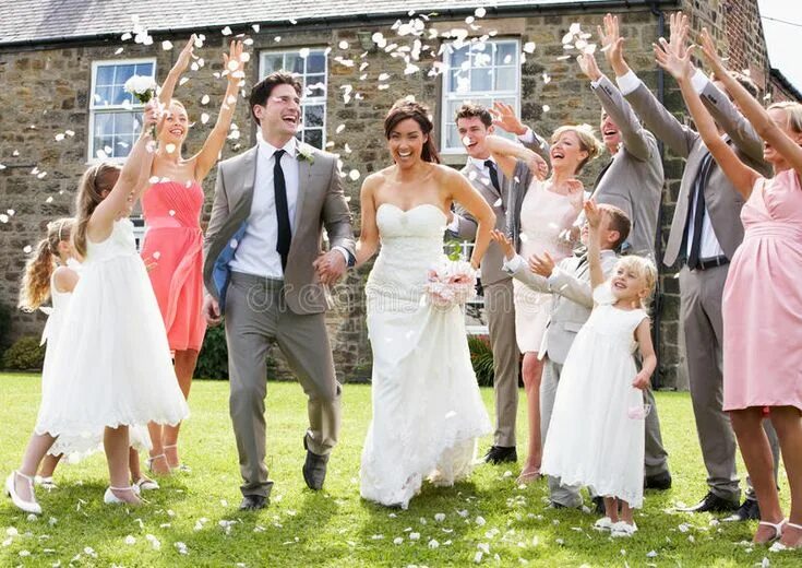 Простая свадьба фото Guests Throwing Confetti Over Bride And Groom. Guests Throwing Confetti Over Smi