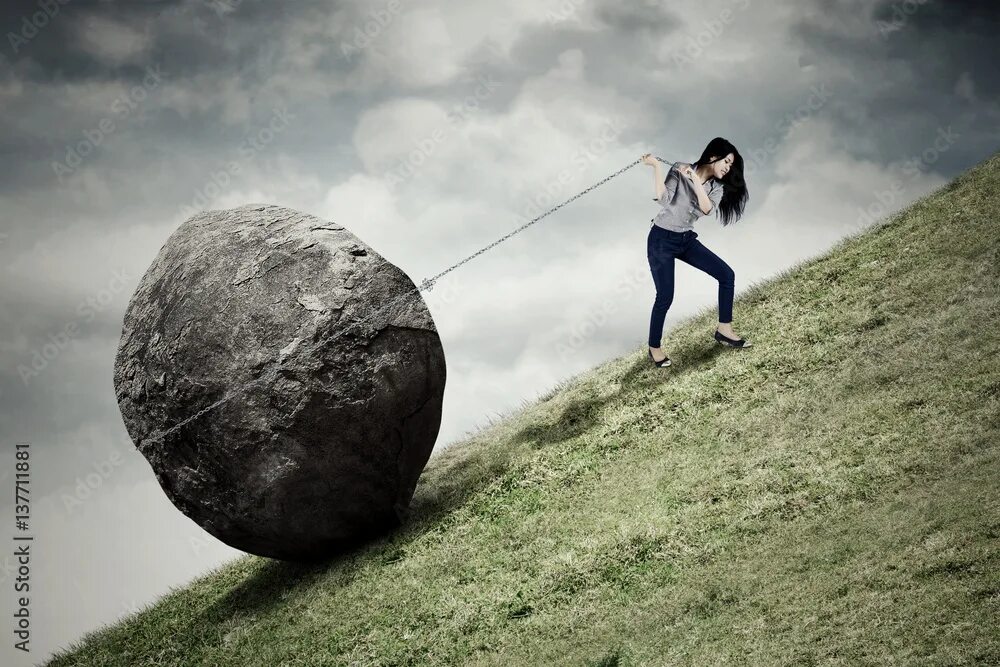 Просто сложно фото Businesswoman pulling stone on the hill Фотографія Stock Adobe Stock