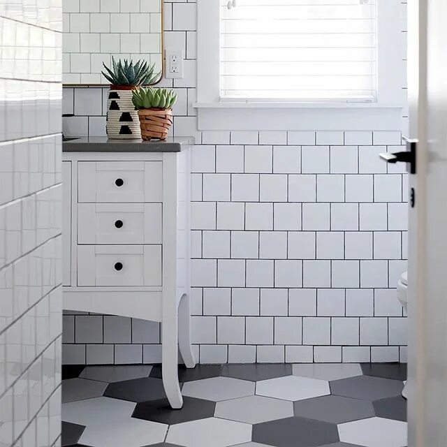 Прямоугольная плитка фото a white tiled bathroom doesn't have to be basic. elevate the look by adding a se