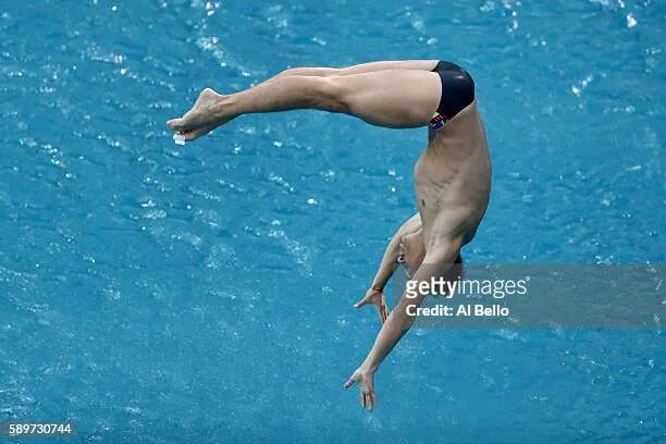 Прыжки в воду фото Illya Kvasha of Ukraine competes in the Men's Diving 3m Springboard... News Phot