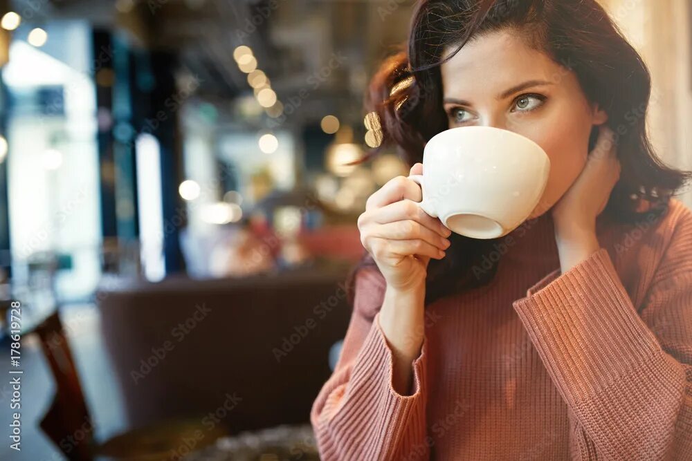 Пью кофе фото без лица woman drinking coffee in a cafe Фотографія Stock Adobe Stock