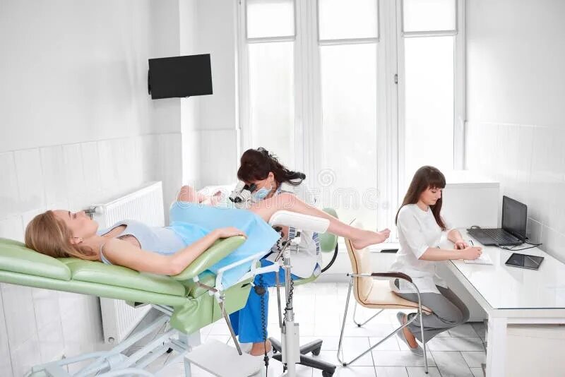 Работа гинеколога фото Professional Gynecologist Examining Her Patient Stock Photo - Image of instrumen