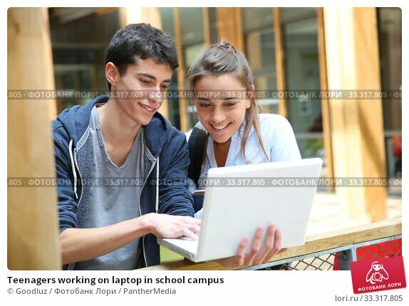 Работа подростков фото Teenagers working on laptop in school campus. Стоковое фото № 33317805, фотограф