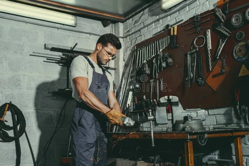 Работа слесарей фото Handsome Mechanic with Tools Stock Photo - Image of handsome, working: 119754148