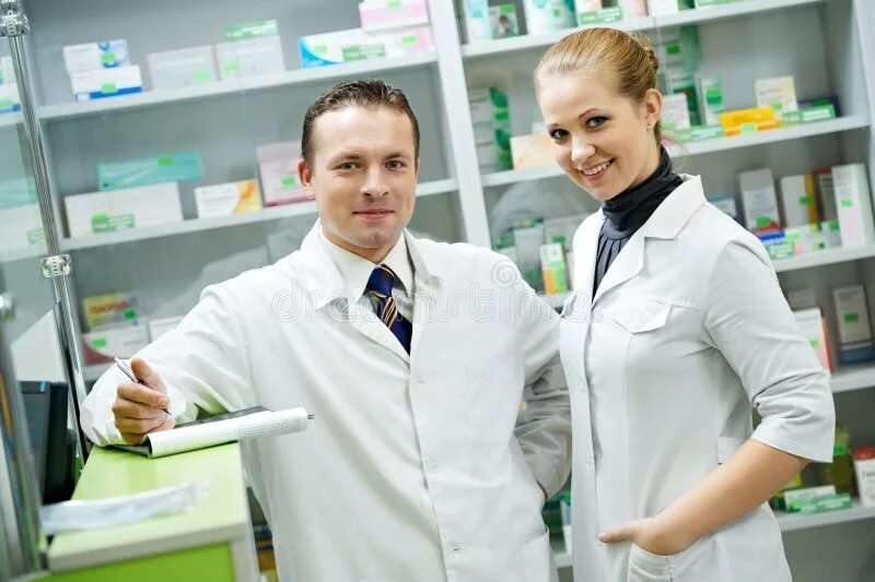 Работа в аптеке фото Team of Pharmaceutist and Technician Working in Chemist Shop Stock Photo - Image