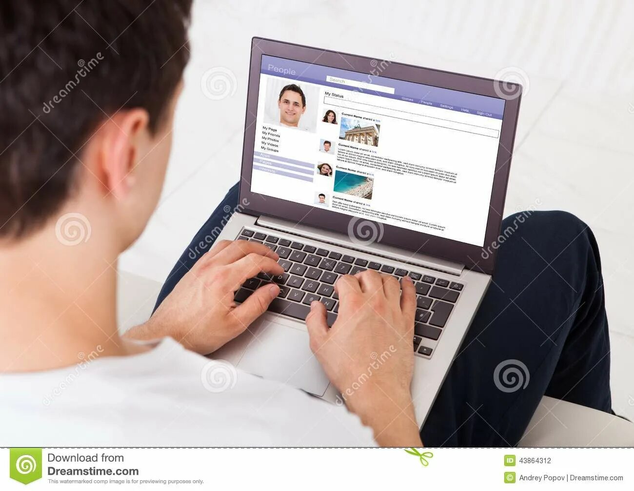 Работа в сети фото Man Using Social Networking Site on Laptop at Home Stock Photo - Image of online