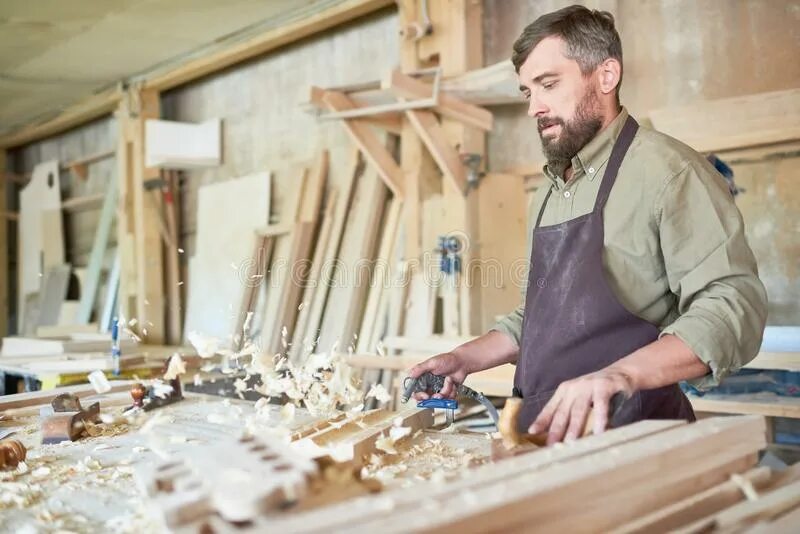 Работы плотников фото Blowing off sawdust stock photo. Image of workshop, serious - 134683828