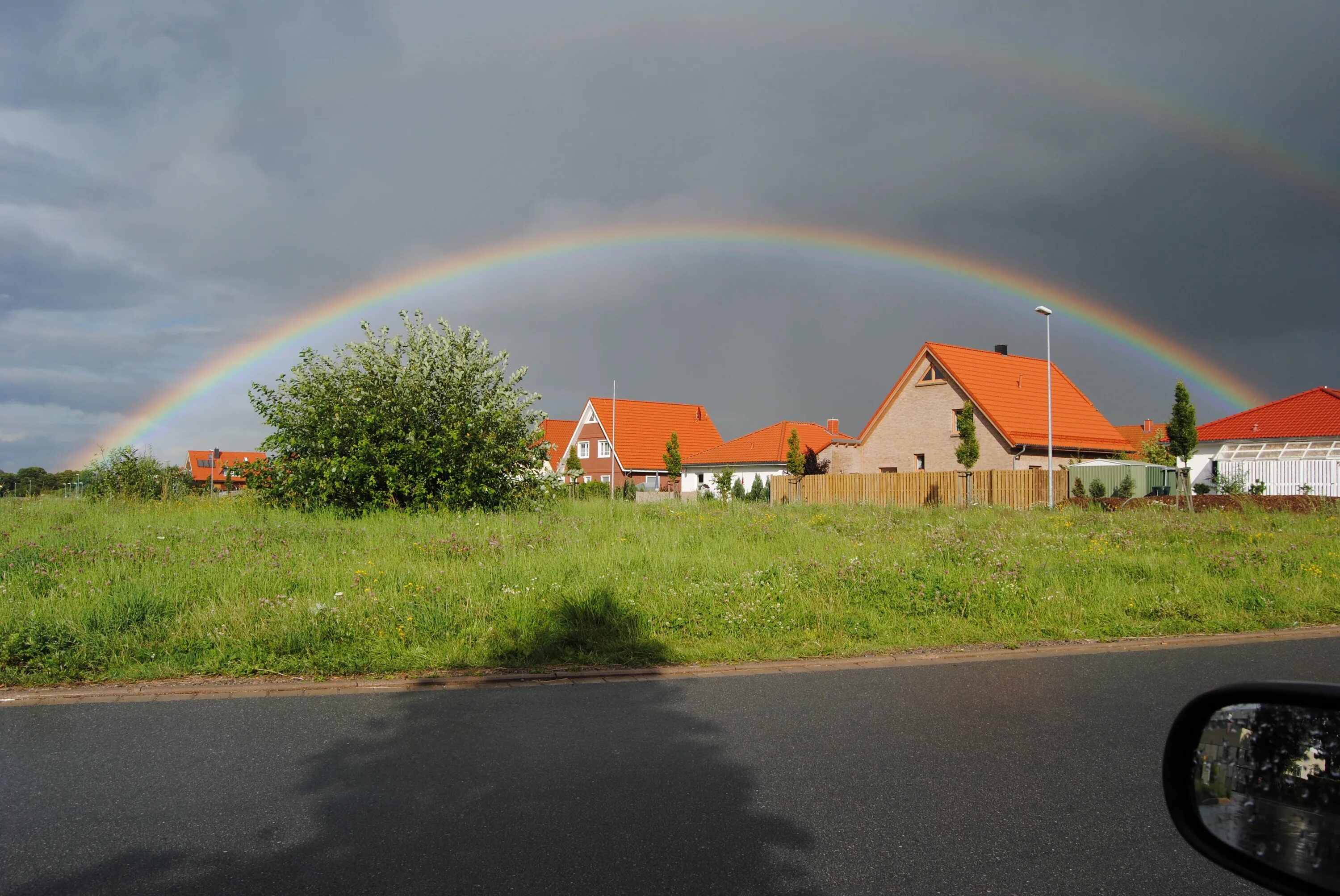 Радуга солнечная ул 3 фото Beautiful landscape of Wennigsen, Germany, with buildings and plants, at colorfu