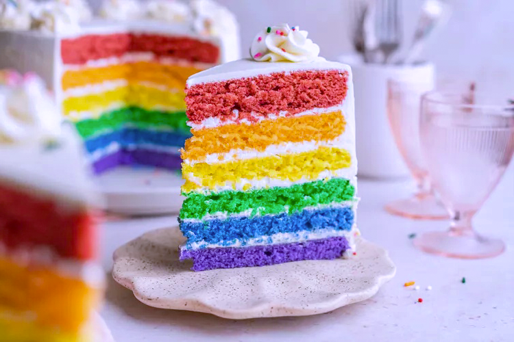 A super easy tutorial to make a stunning and delicious Six Layer Rainbow Cake! P