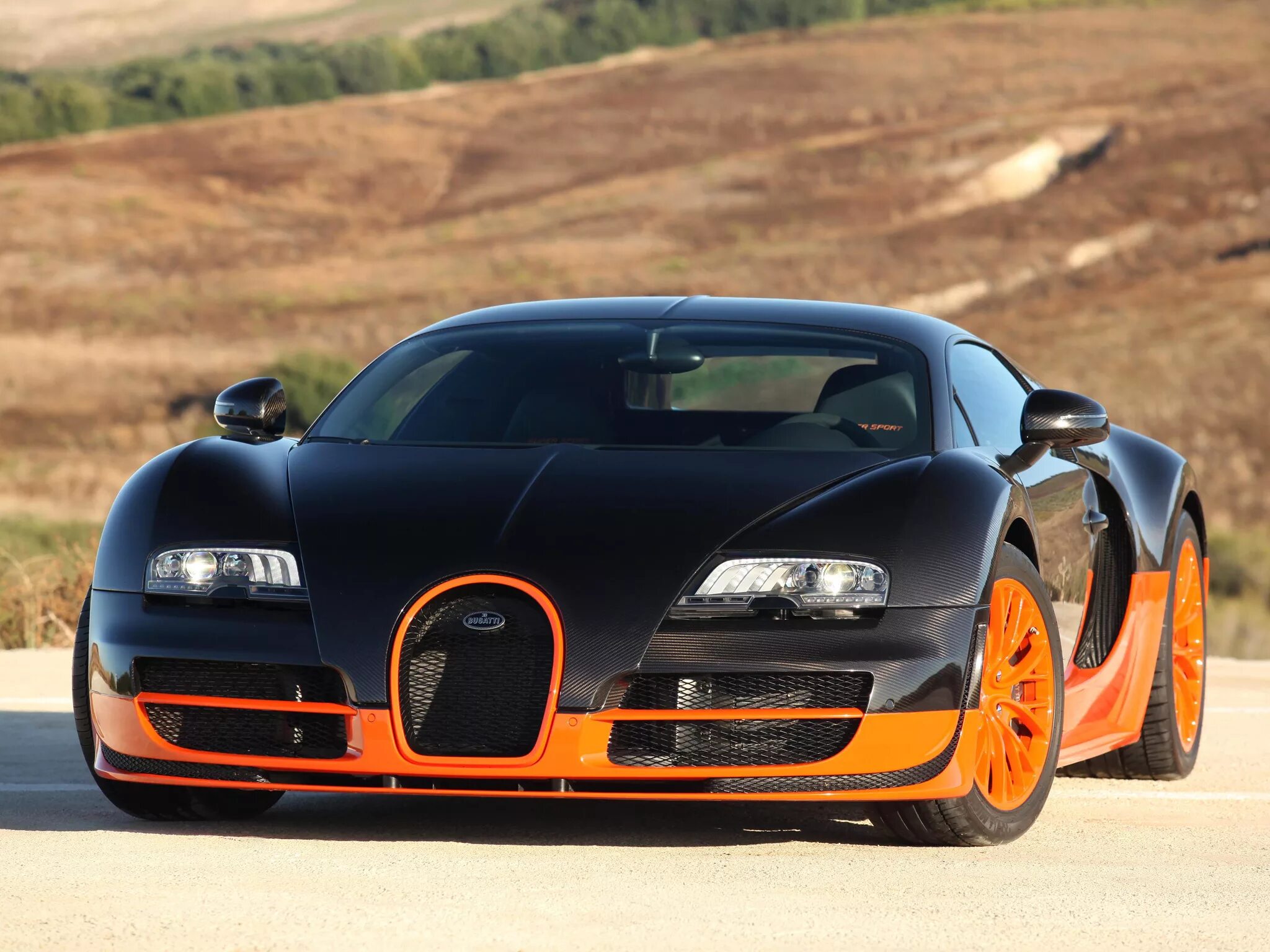 Район фото автомобиля Download wallpaper supercar, Bugatti Veyron, black, Super Sport, orange, hyperca