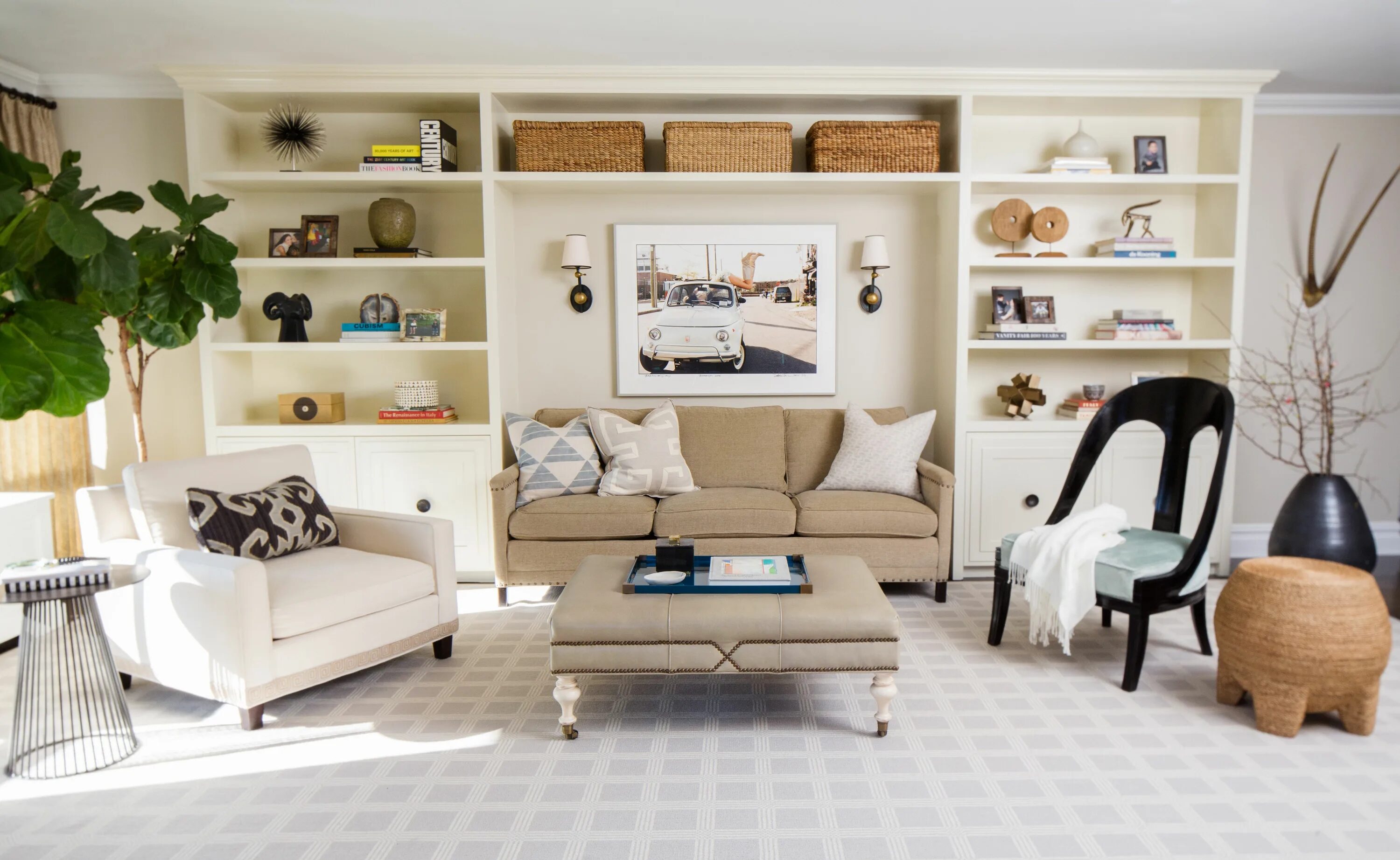 Разная мебель в интерьере гостиной Built in bookshelves provide a focal point in this Manhattan Living Room by BOWE