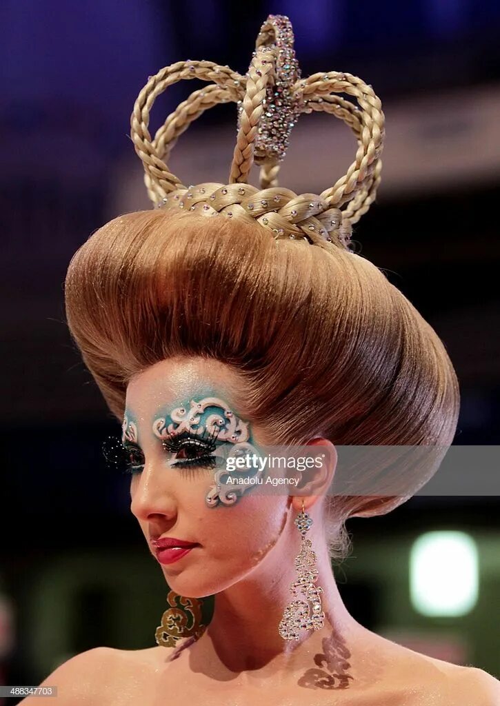 Разновидности причесок фото Models walk on the podium during the OMC Hairworld World Cup contest... Competit