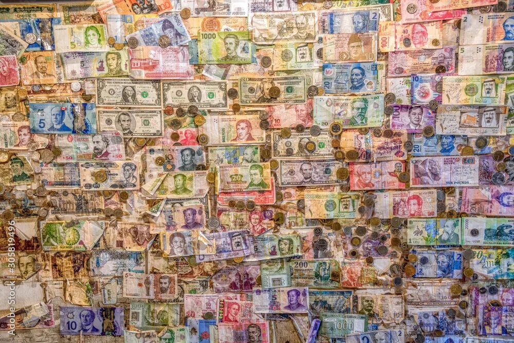 Разные деньги мира фото An assortment money currencies stuck on a wall Stock Photo Adobe Stock