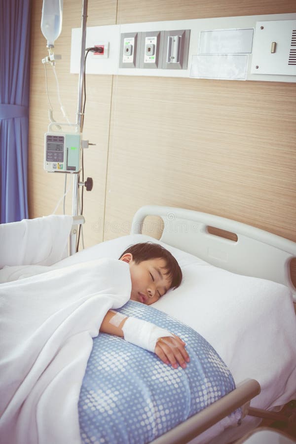 Ребенок в больнице фото в палате Asian Boy Lying on Sickbed with Saline Intravenous (IV). Health Stock Image - Im