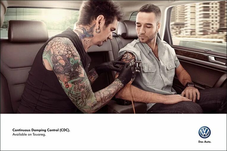 Реклама тату фото Joe La Pompe advertising, publicité - Tattoo Artist Performing in a car / Tattoo