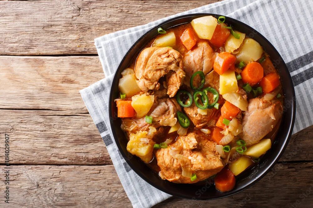 Резота блюдо рецепт с фото с курицей Korean food: Dakdoritang chicken stew with vegetables close-up on a plate. Horiz